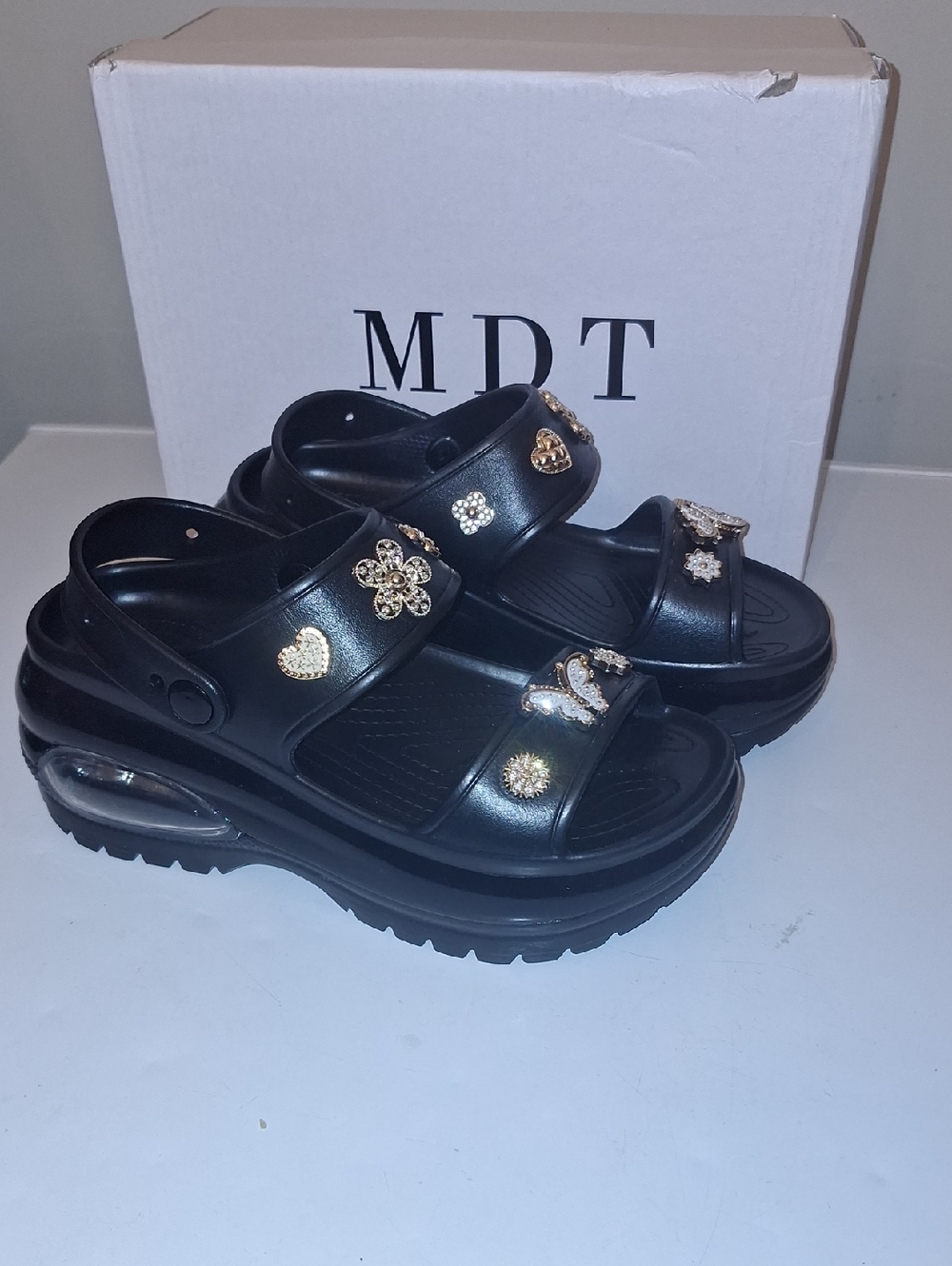Black Platform Sandals with Gold Embellishments